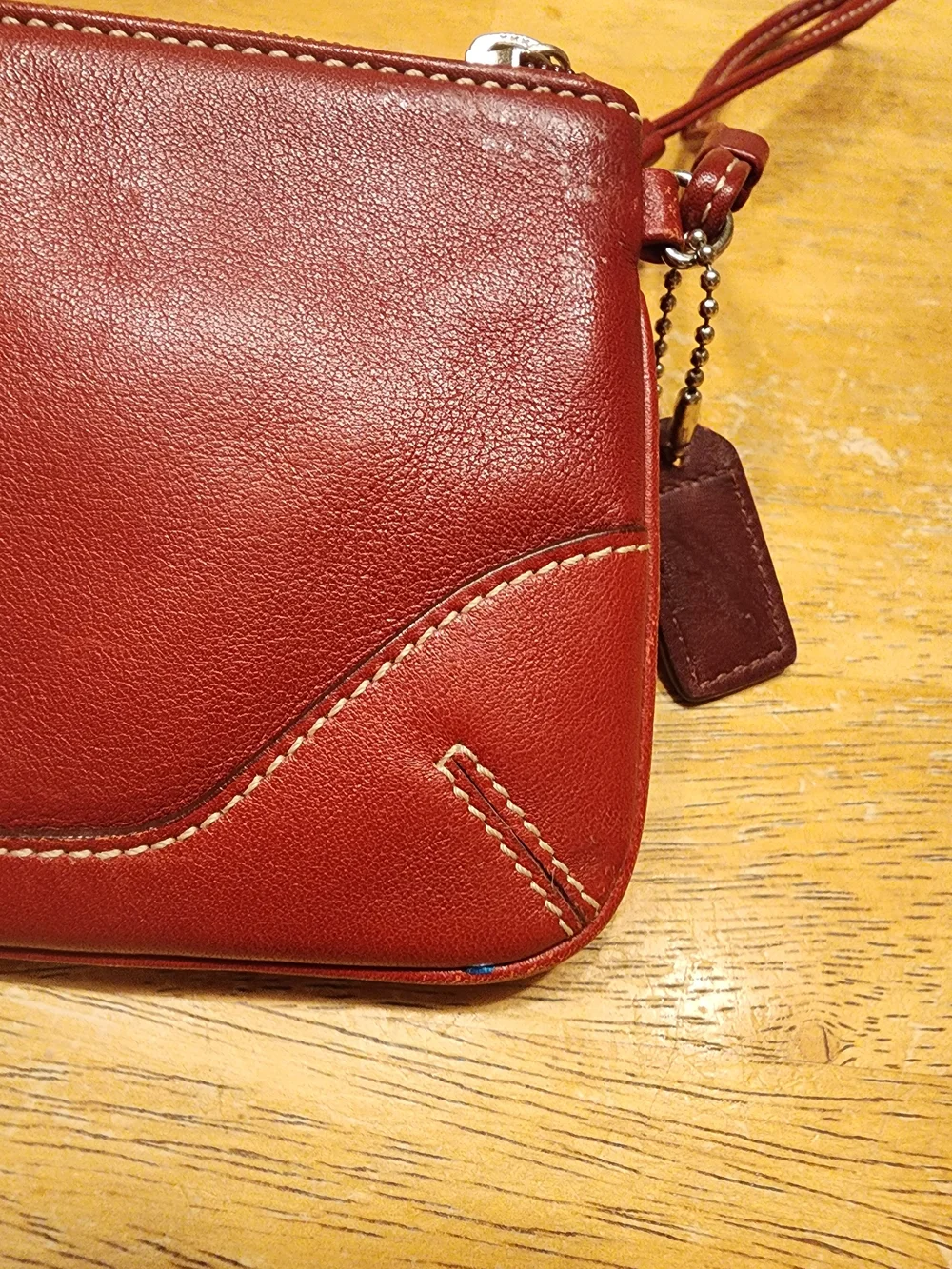 vintage Coach red leather Soho mini wristlet pouch featuring white contrast